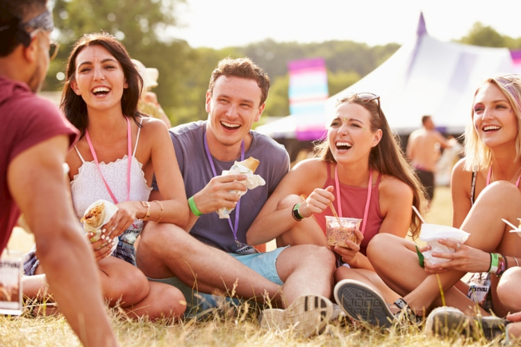 people-eating-food-on-grass