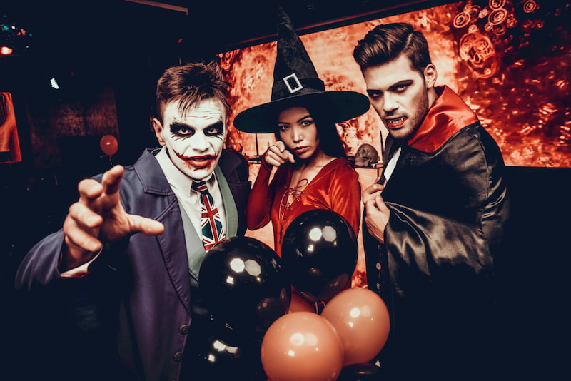 a group of friends in halloween costumes pose for the camera at the hollywood halloween carnaval