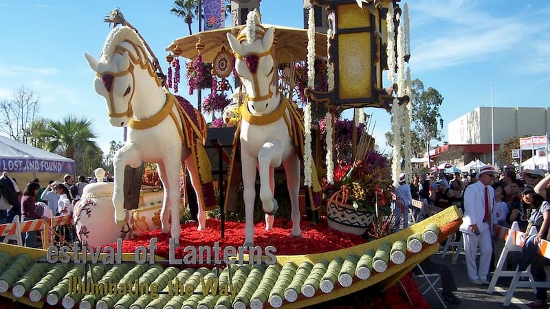 a flower-covered float in the Rose Parade depicts a horse pulling a carriage