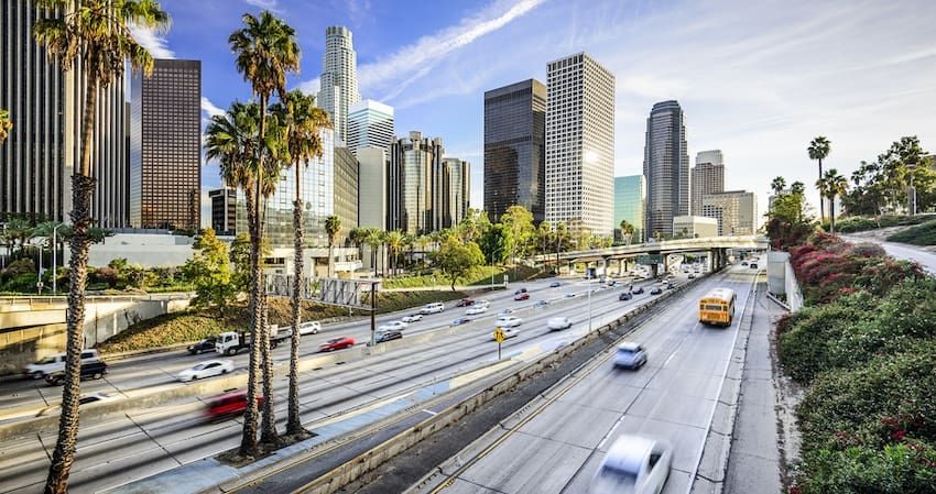 view of downtown Los Angeles from a busy highway