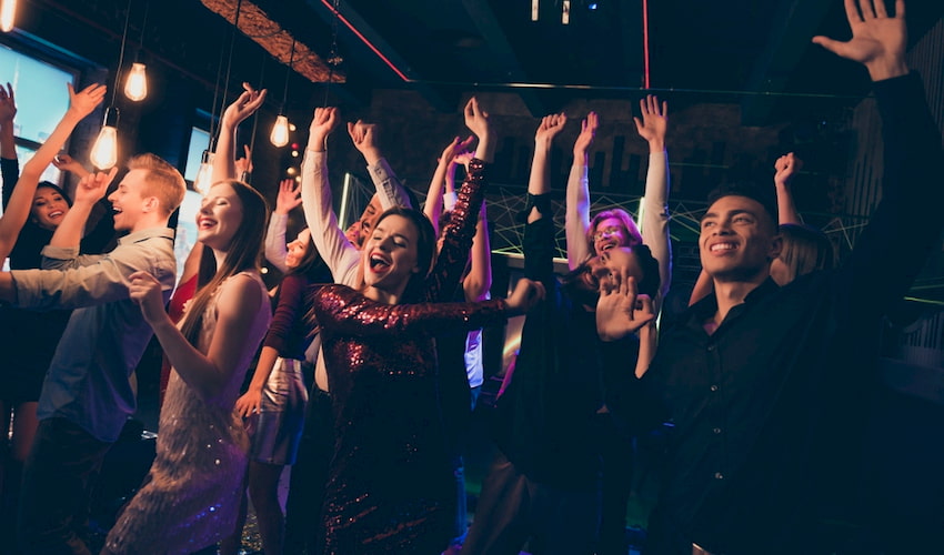 employee dance at a dimly lit company party in Los Angeles California