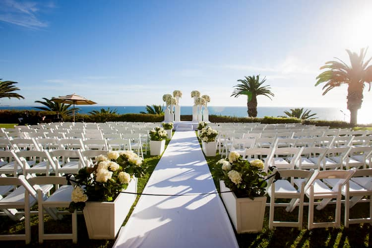 Wedding ceremony on bluffs in front of ocean at Bel-Air