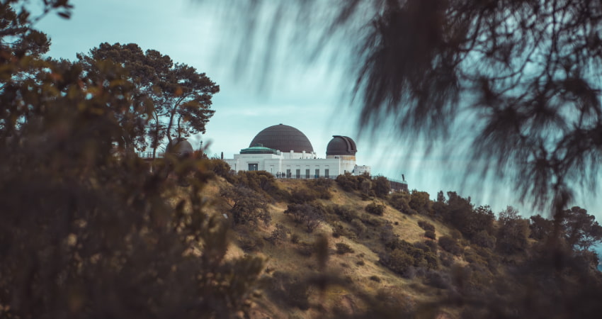 Exterior view of the Griffith Observatory on top of a hill