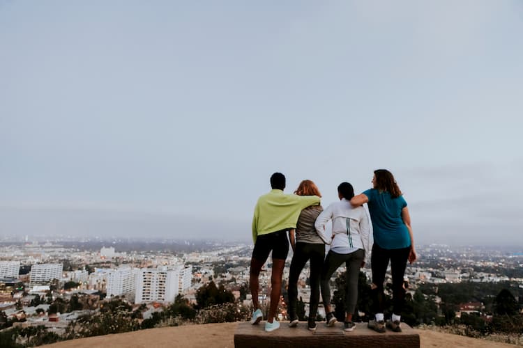 Friends overlooking LA from the mountains