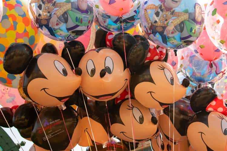 A bunch of Mickey Mouse and Minnie Mouse balloons