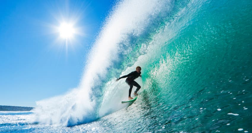 A surfer in a barrel wave