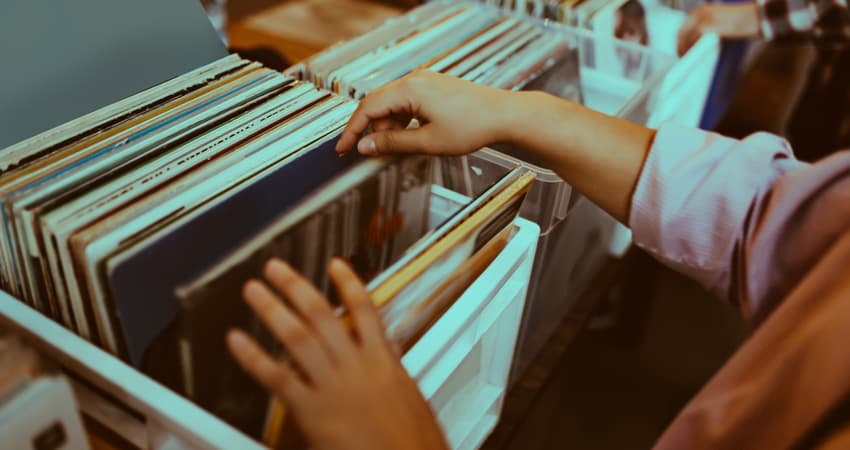 A customer browsing through vinyl records 