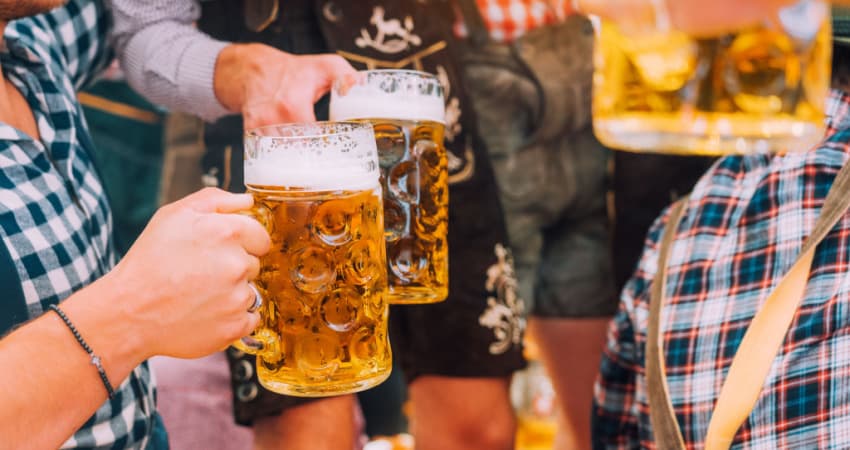 people toasting beer at a german beer hall