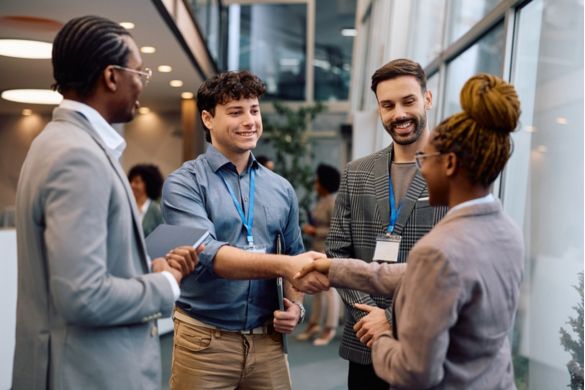 a professional group of people talk at a conference